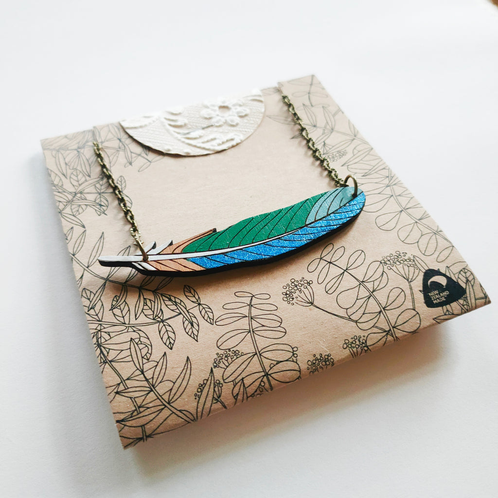 Tui feather necklace