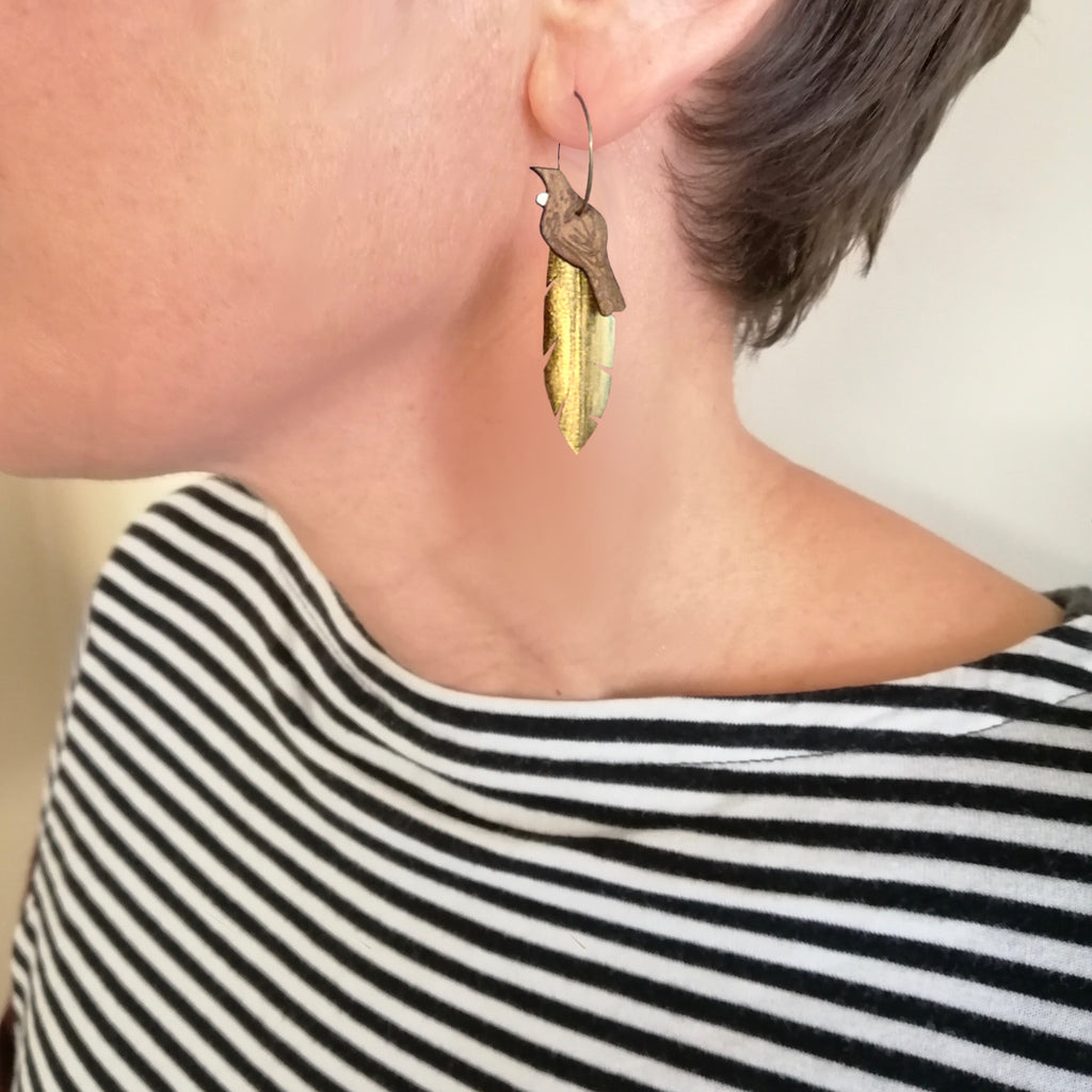 Tui on Gold feather earrings