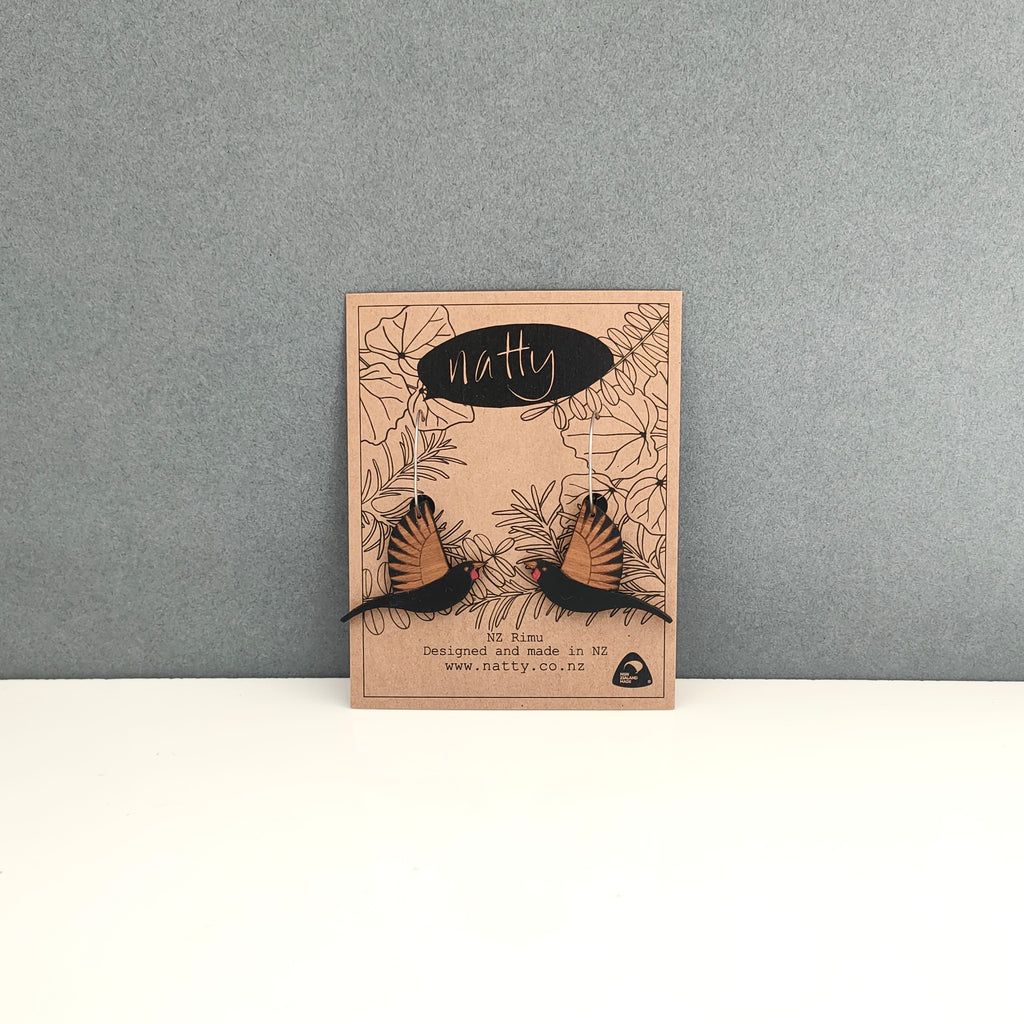 Saddleback/tieke earrings