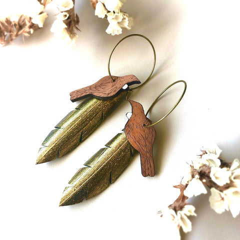 Tui on Gold feather earrings