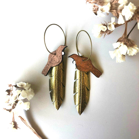 Tui on Gold feather earrings